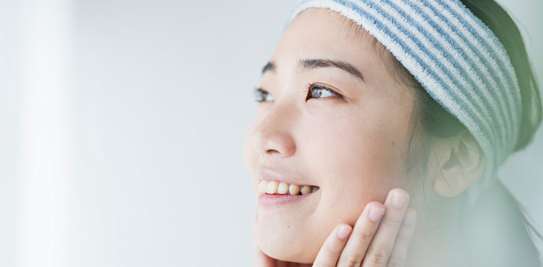 Woman cleaning her skin