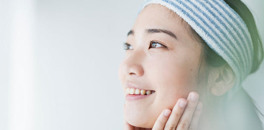 Woman cleaning her skin