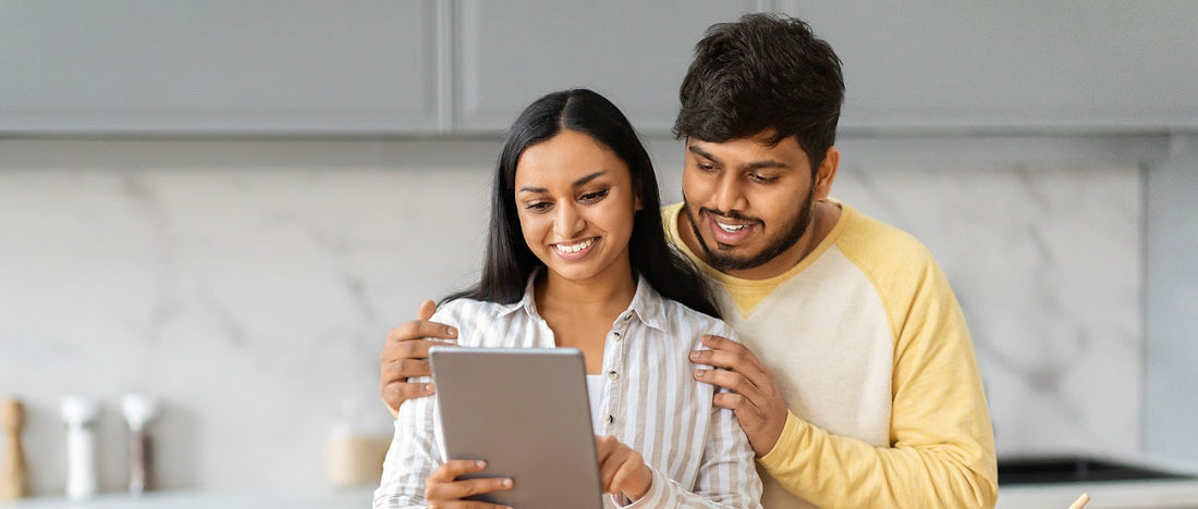 Couple with a tablet in the kitchen