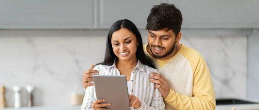 Couple with a tablet in the kitchen