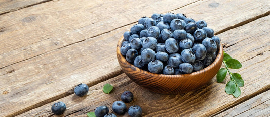 Blueberries in a wooden bowl, a source of antioxidants