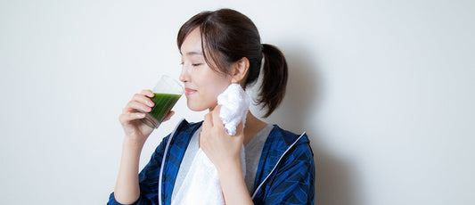 Woman drinking chlorella powder