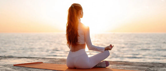 Woman practicing yoga to relax and boost energy