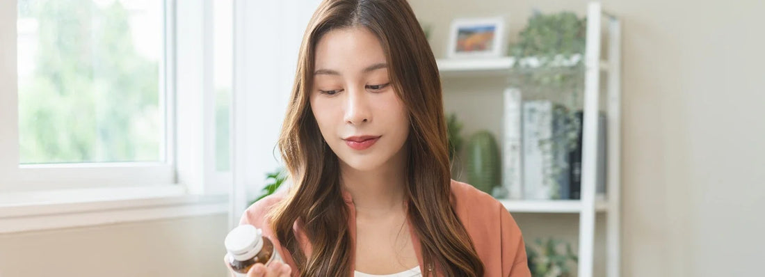 Woman reading the food supplements label