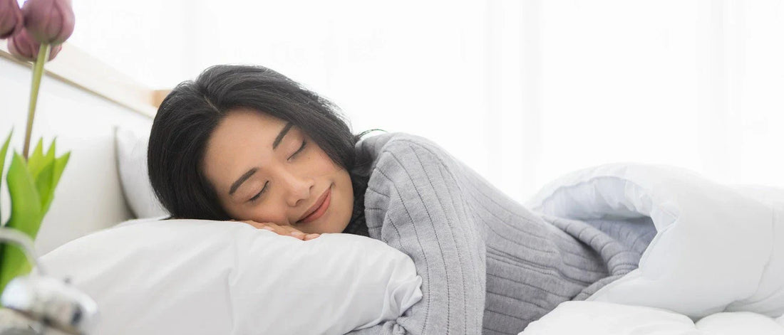 Woman has a good quality sleep in bed